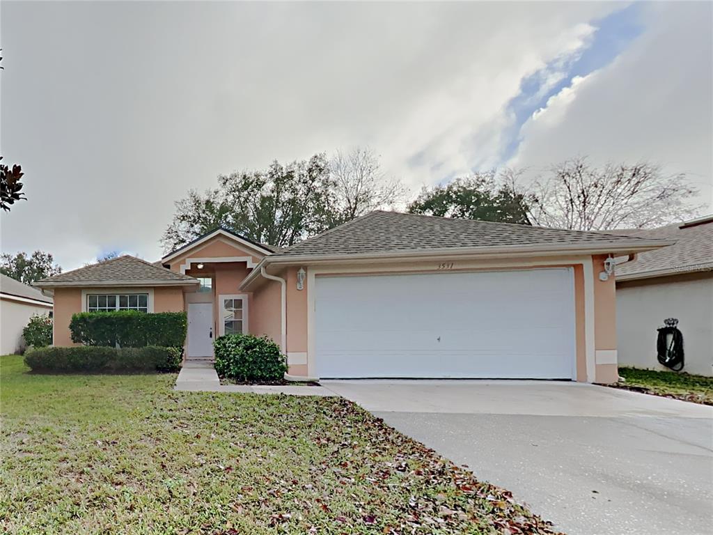 3531 Kayla Circle Oviedo, FL 32765 - Photo 1 of 1 a front view of a house with a garden