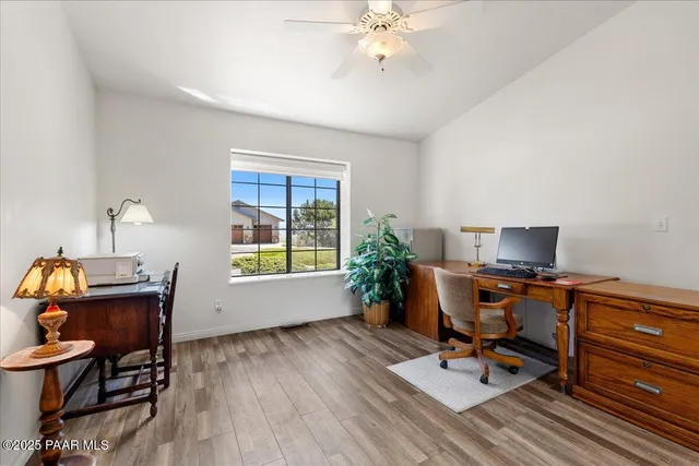 a workspace with furniture and a window