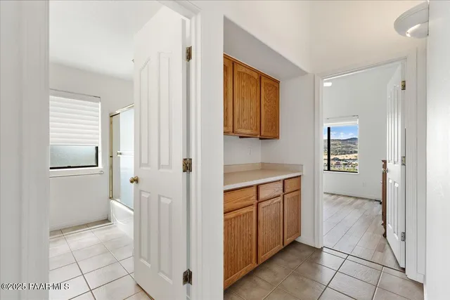 a view of kitchen with stainless steel appliances granite countertop a refrigerator and a sink