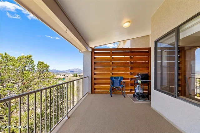 a view of balcony with furniture