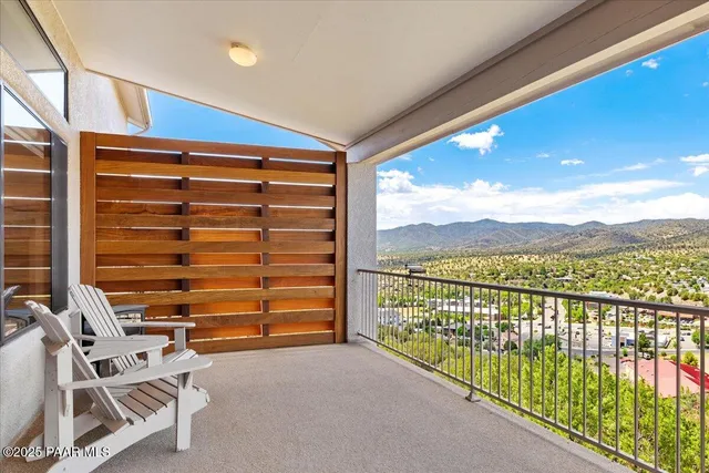 a view of balcony with furniture