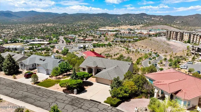 an aerial view of residential houses with outdoor space