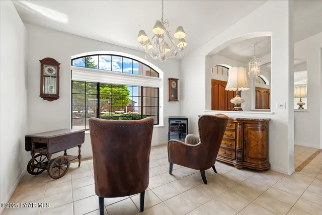 a view of a livingroom with furniture and a potted plant