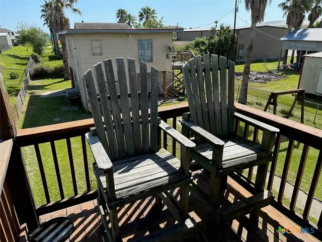 a view of a chairs on the roof deck