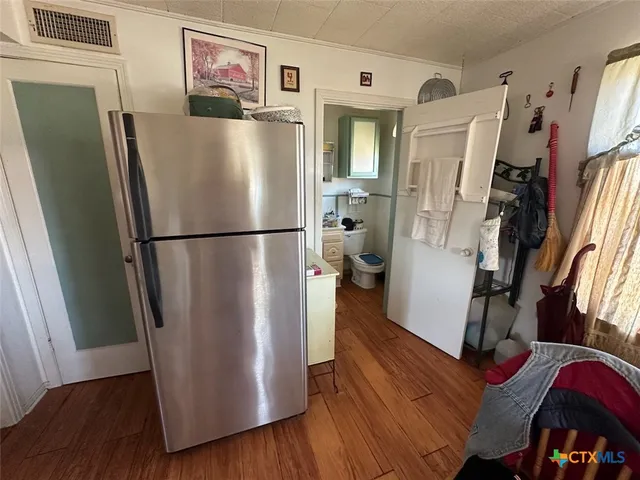 a white refrigerator freezer sitting inside of a kitchen