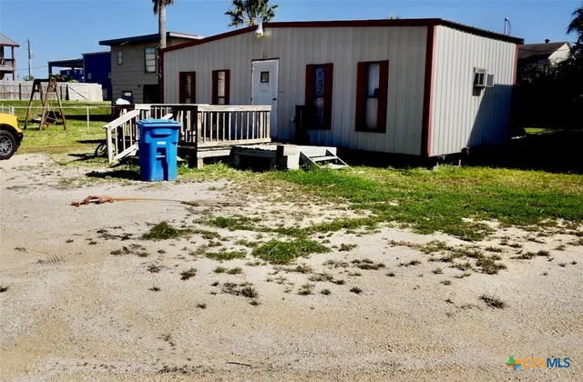 a view of a porch with wooden floor