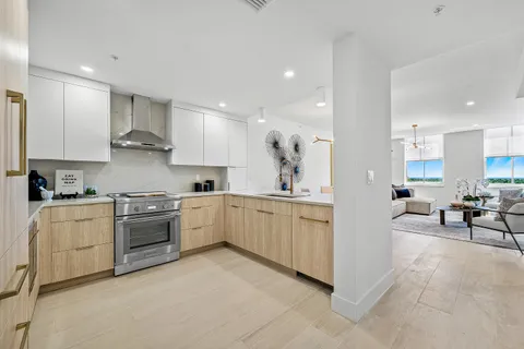 a bedroom with a bed and large window