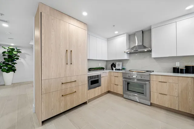 a bedroom with a bed and large window