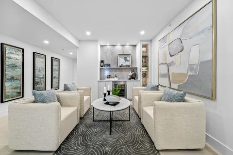 a kitchen with white cabinets and white appliances