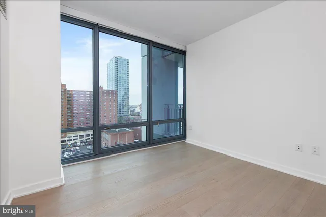 an empty room with large window