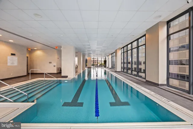 a view of swimming pool with seating area