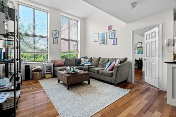 a living room with furniture and a large window