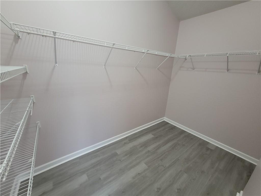 2213 Carlton Chase Road Dacula, GA 30019 - Photo 17 of 30 a view of a room with racks on the wall