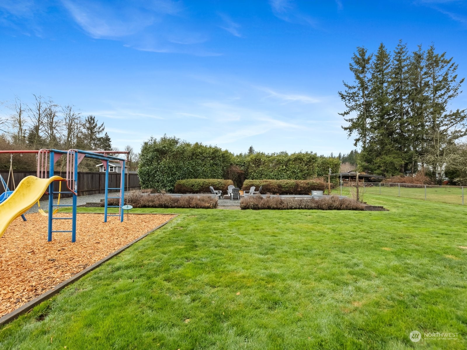 25329 Cromwell Road Monroe, WA 98272 - Photo 22 of 32 a view of a garden with lawn chairs