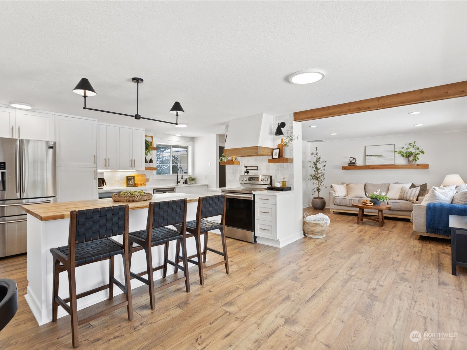 25329 Cromwell Road Monroe, WA 98272 - Photo 4 of 32 a kitchen with a dining table chairs and wooden floor