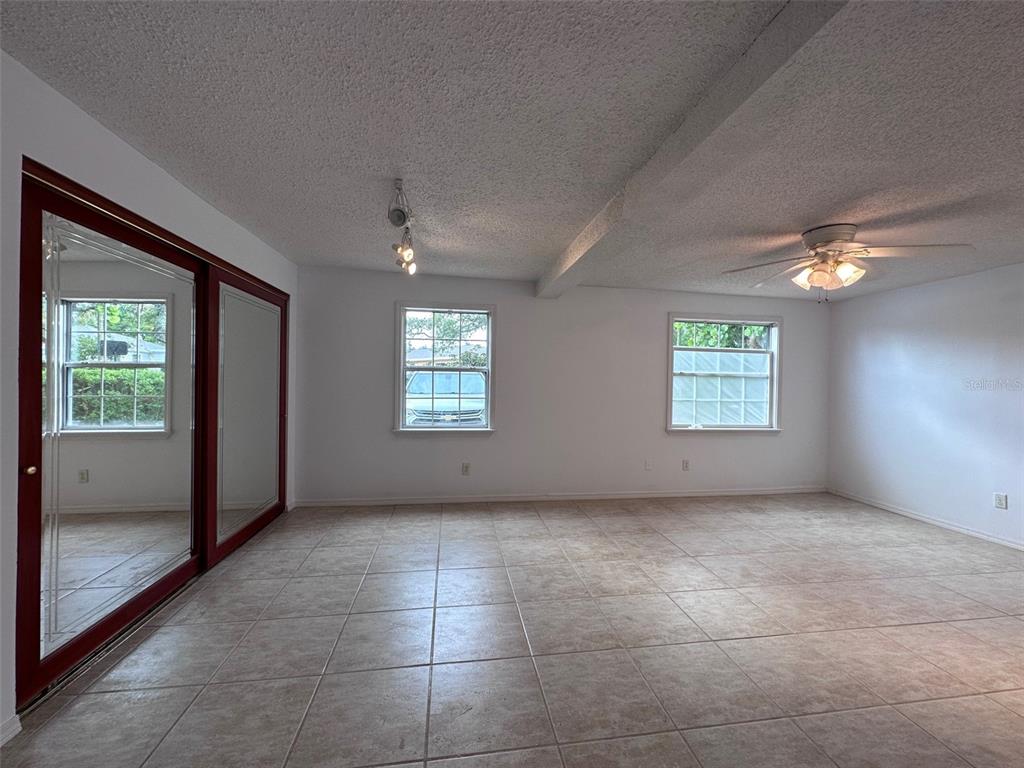 315 Sunburst Court Clearwater, FL 33755 - Photo 12 of 23 an empty room with windows