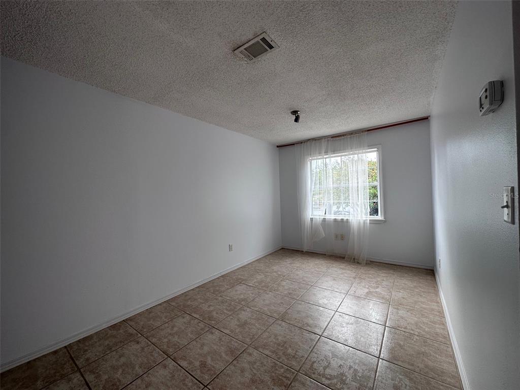 315 Sunburst Court Clearwater, FL 33755 - Photo 13 of 23 a view of an empty room with a window