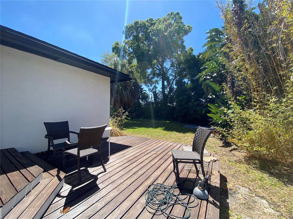 315 Sunburst Court Clearwater, FL 33755 - Photo 20 of 23 a view of a swimming pool with chair and table