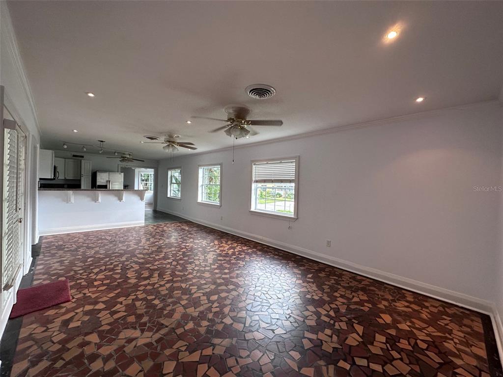 315 Sunburst Court Clearwater, FL 33755 - Photo 6 of 23 wooden floor in an empty room with a window