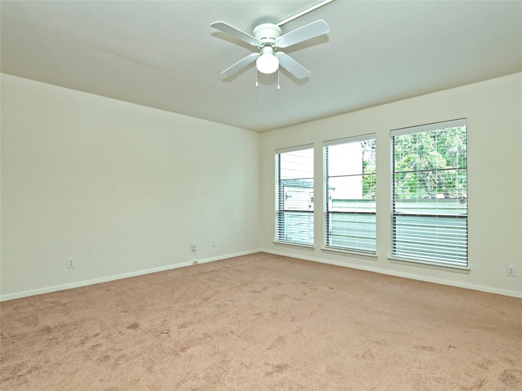 3 Casa Verde Street Lakeway, TX 78734 - Photo 16 of 30 an empty room with a window and a ceiling fan