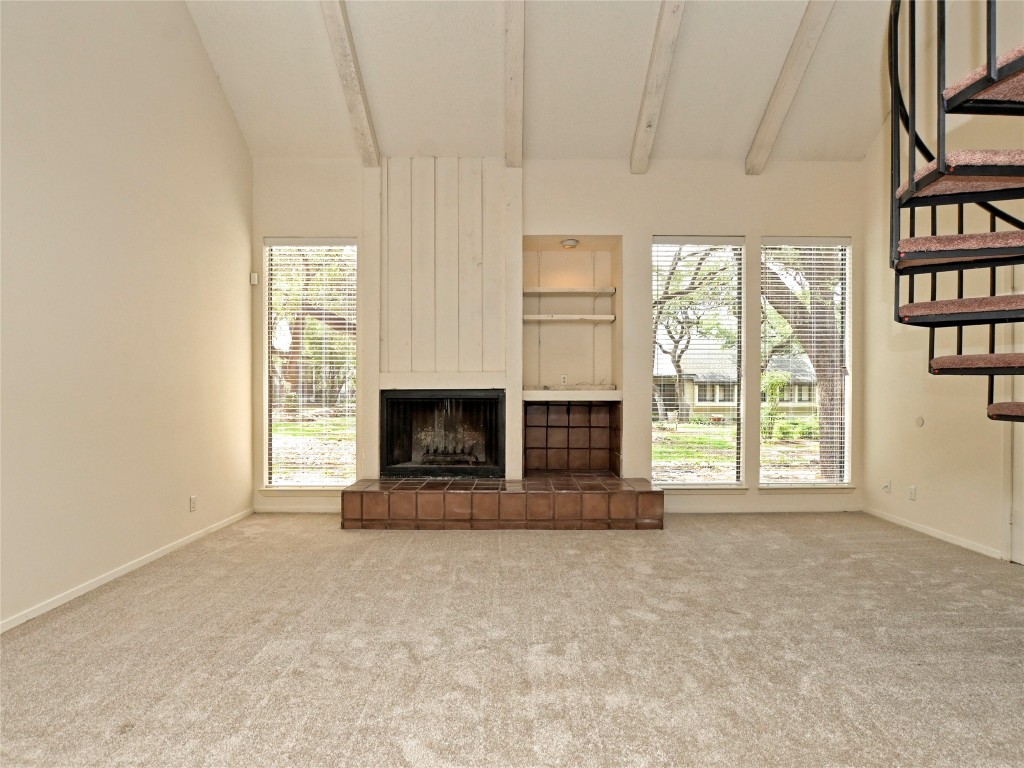 3 Casa Verde Street Lakeway, TX 78734 - Photo 3 of 30 a view of an empty room with a fireplace and a window
