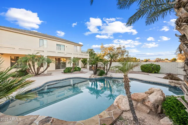 a view of a patio with swimming pool
