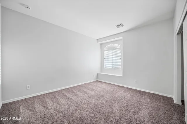 a bathroom with a double vanity sink a mirror and a bathtub