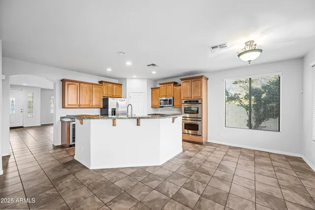 a view of kitchen with furniture and large window