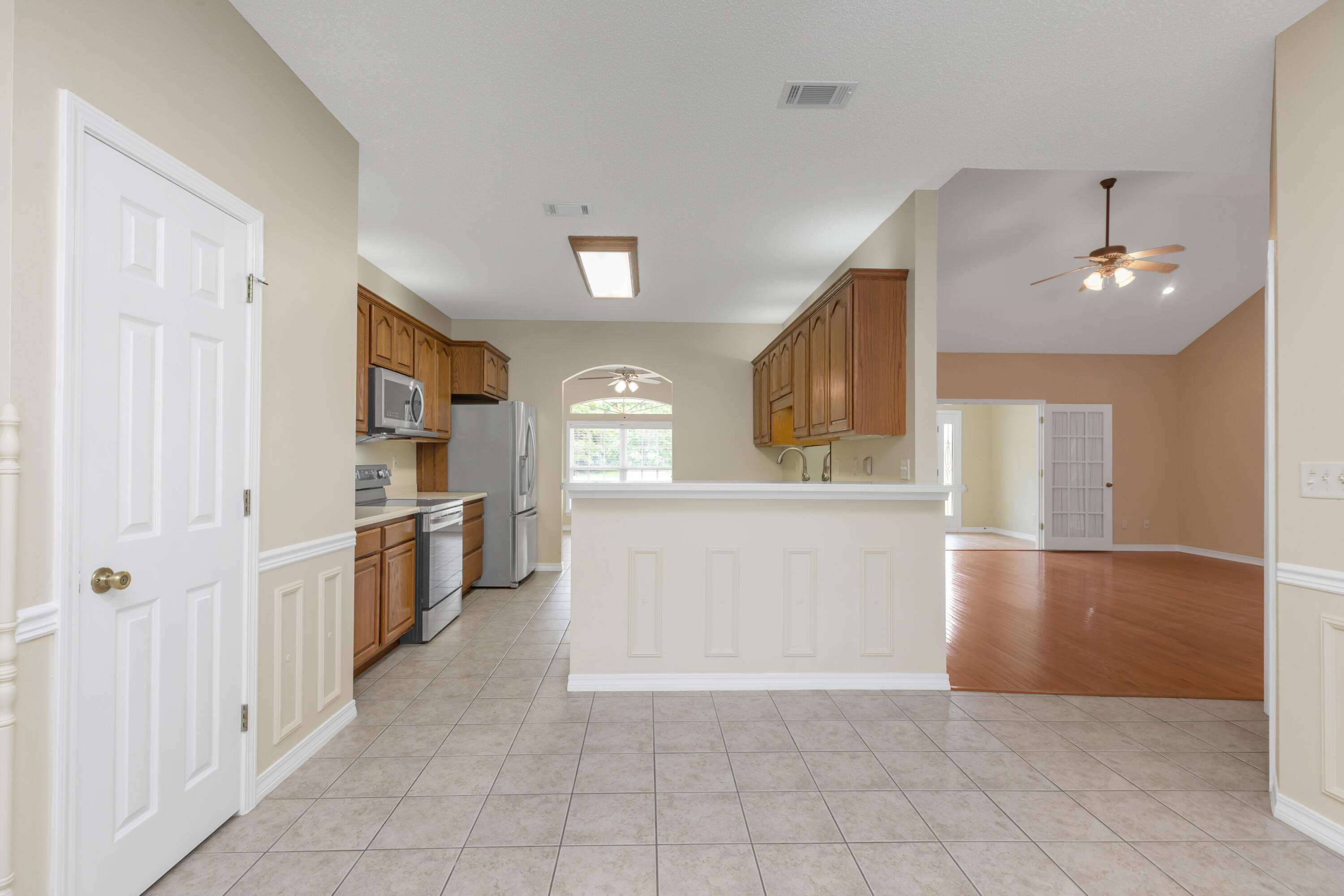 5552 Frontier Drive Crestview, FL 32536 - Photo 24 of 54 a view of a kitchen with a sink and dishwasher cabinets