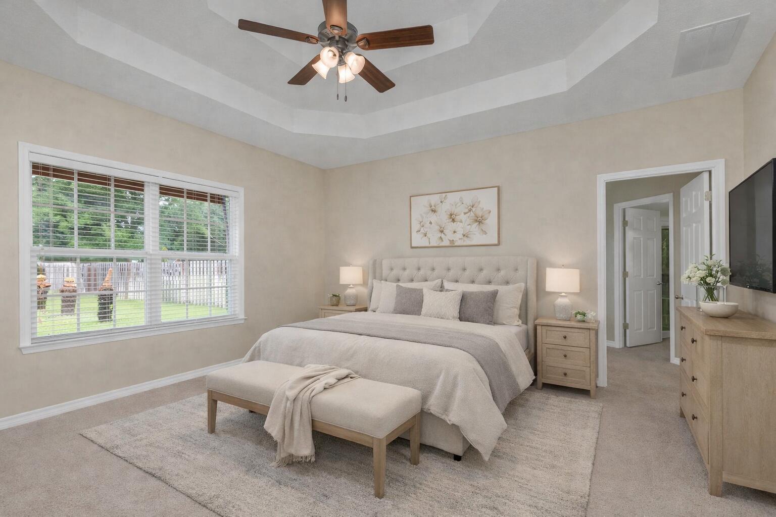 5552 Frontier Drive Crestview, FL 32536 - Photo 27 of 54 a bedroom with a large bed and a chandelier