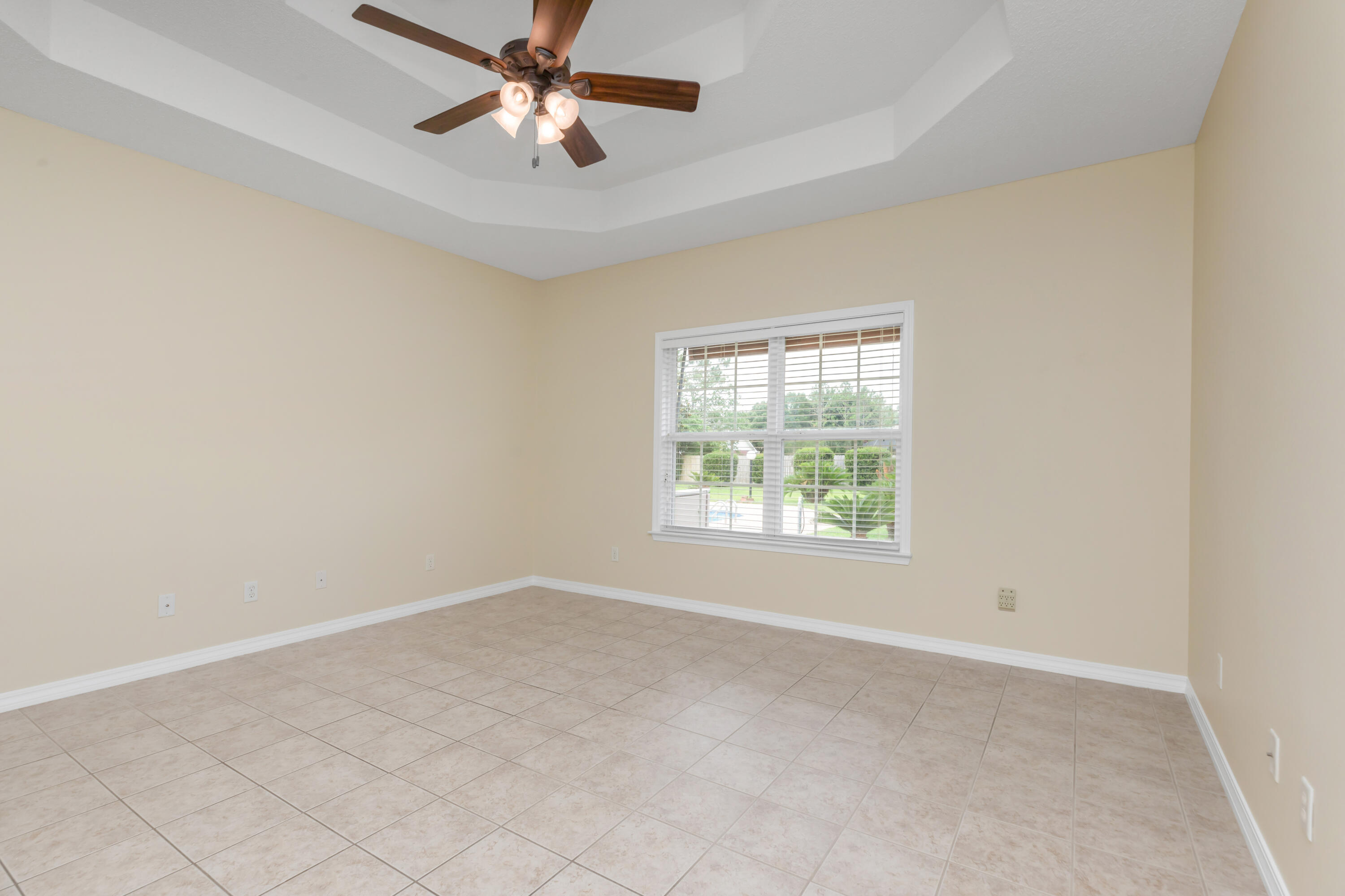 5552 Frontier Drive Crestview, FL 32536 - Photo 31 of 54 an empty room with windows and fan