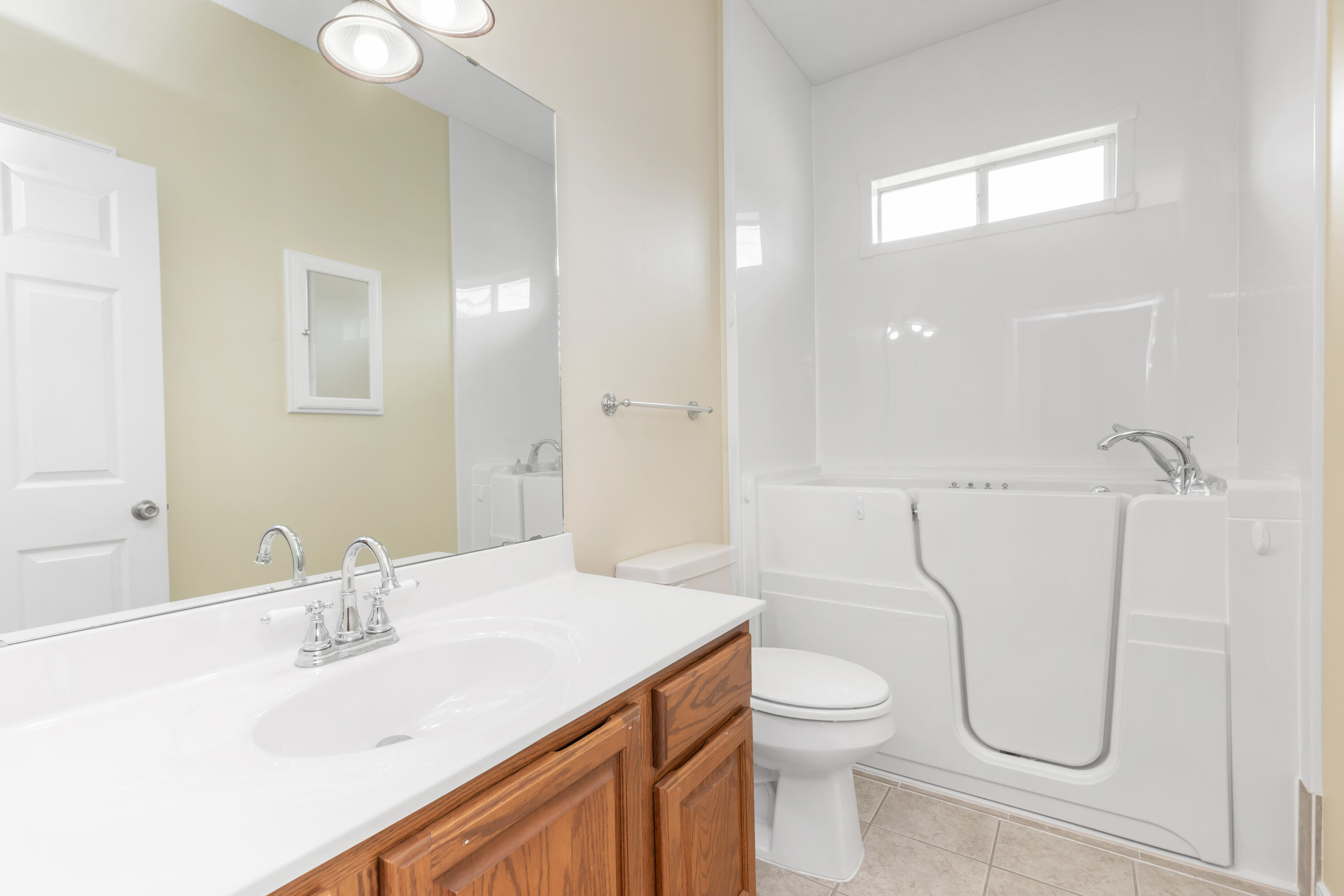 5552 Frontier Drive Crestview, FL 32536 - Photo 39 of 54 a bathroom with a granite countertop sink a toilet and a mirror