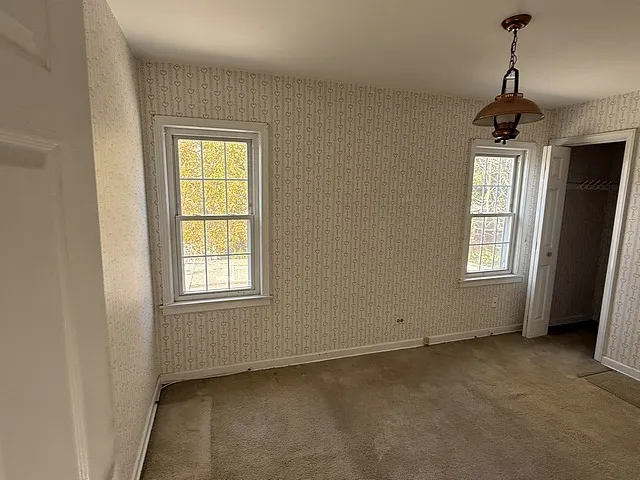 wooden floor and window in an empty room