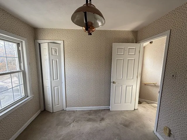 a view of a hallway with stairs