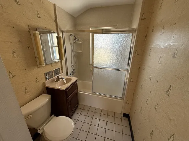 a bathroom with a sink a mirror and a shower