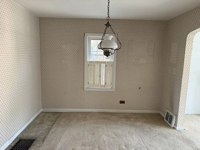 a bathroom with a granite countertop sink a mirror and a window