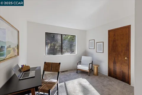 a view of a backyard with sitting area