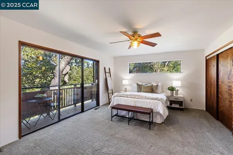 a view of yard with swimming pool and seating area