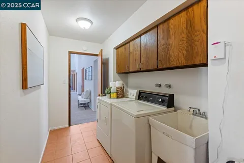 a spacious bedroom with a bed and a large window