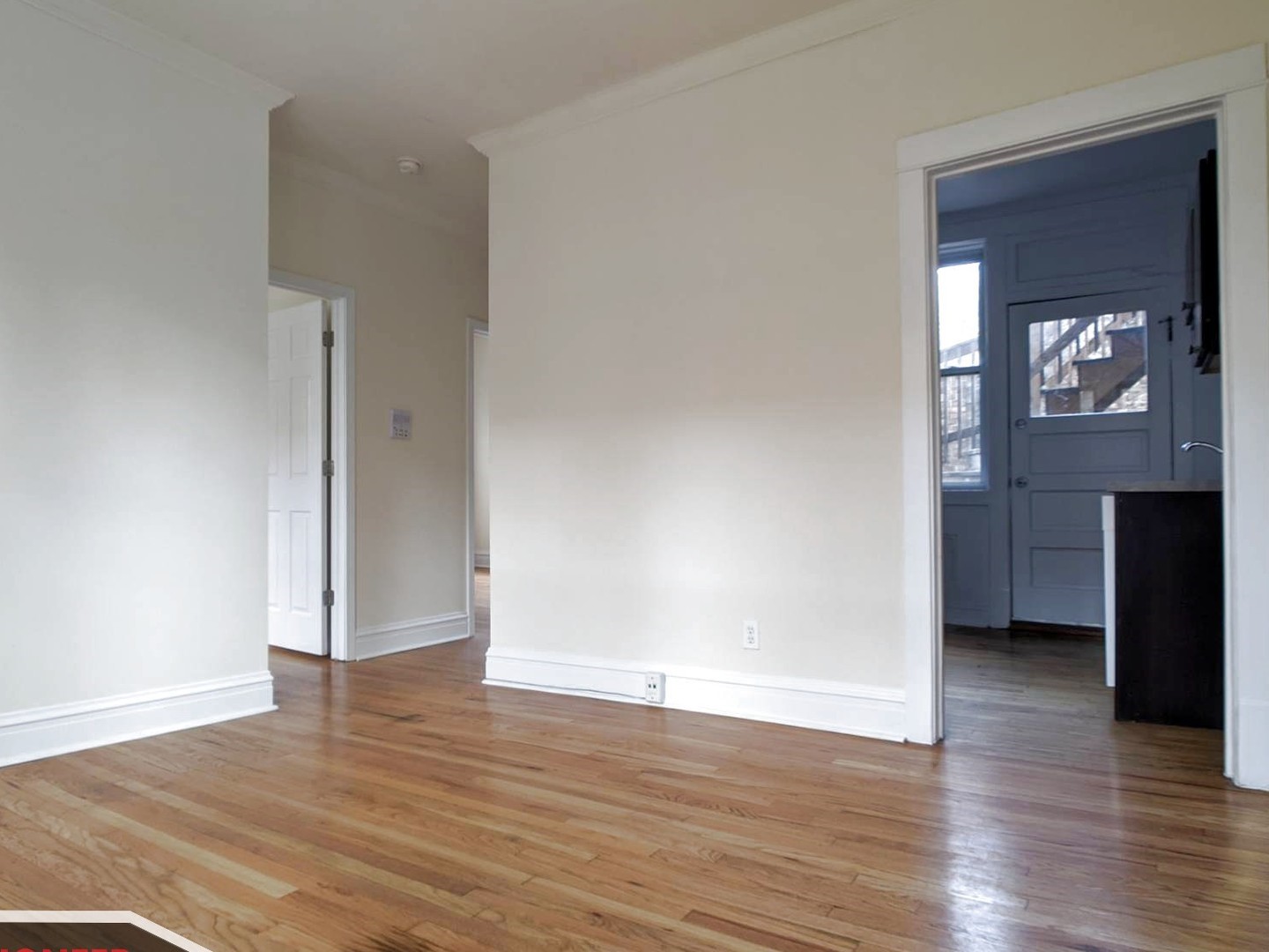 2919 West George Street, Unit 2 Chicago, IL 60618 - Photo 4 of 14 an empty room with wooden floor and closet