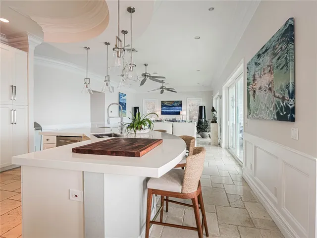 a kitchen with stainless steel appliances kitchen island granite countertop a sink and cabinets