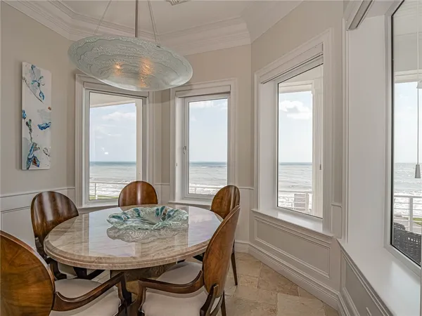 a view of a dining room with furniture window and outside view