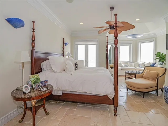 a bed room with a bed and a chair