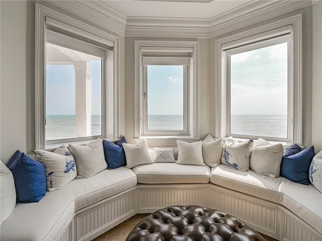 a living room with a couch and a large window