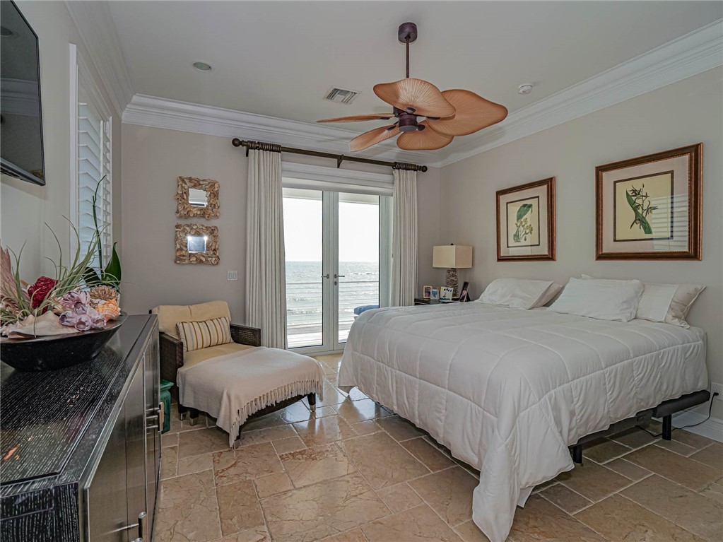2250 Sanderling Lane Vero Beach, FL 32963 - Photo 19 of 36 a spacious bedroom with a bed and a chandelier