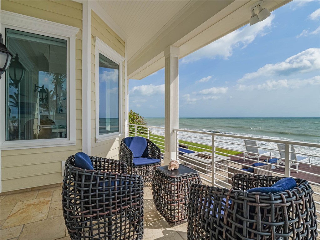 2250 Sanderling Lane Vero Beach, FL 32963 - Photo 22 of 36 a roof deck with outdoor seating and city view