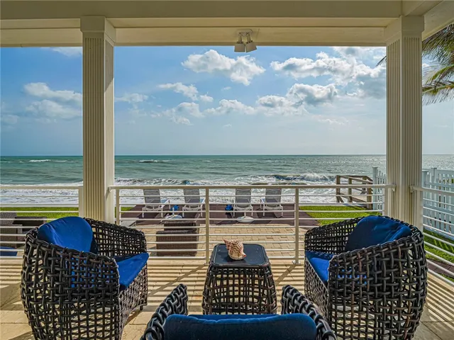 a view of a balcony with wooden floor and outdoor space