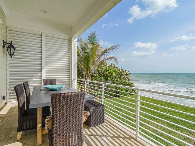 a view of a chairs and table on the deck