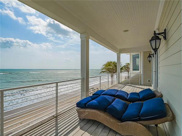 a view of balcony with furniture