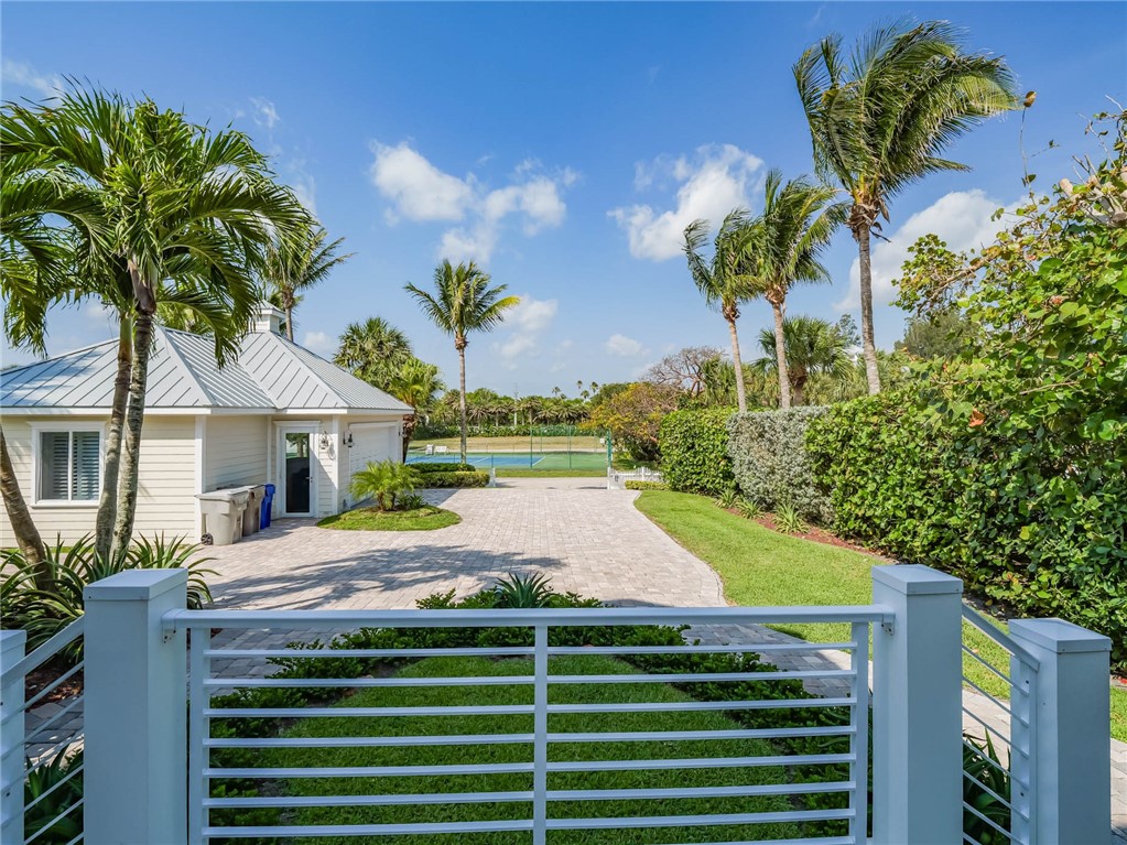 2250 Sanderling Lane Vero Beach, FL 32963 - Photo 4 of 36 a view of a backyard with a garden and plants